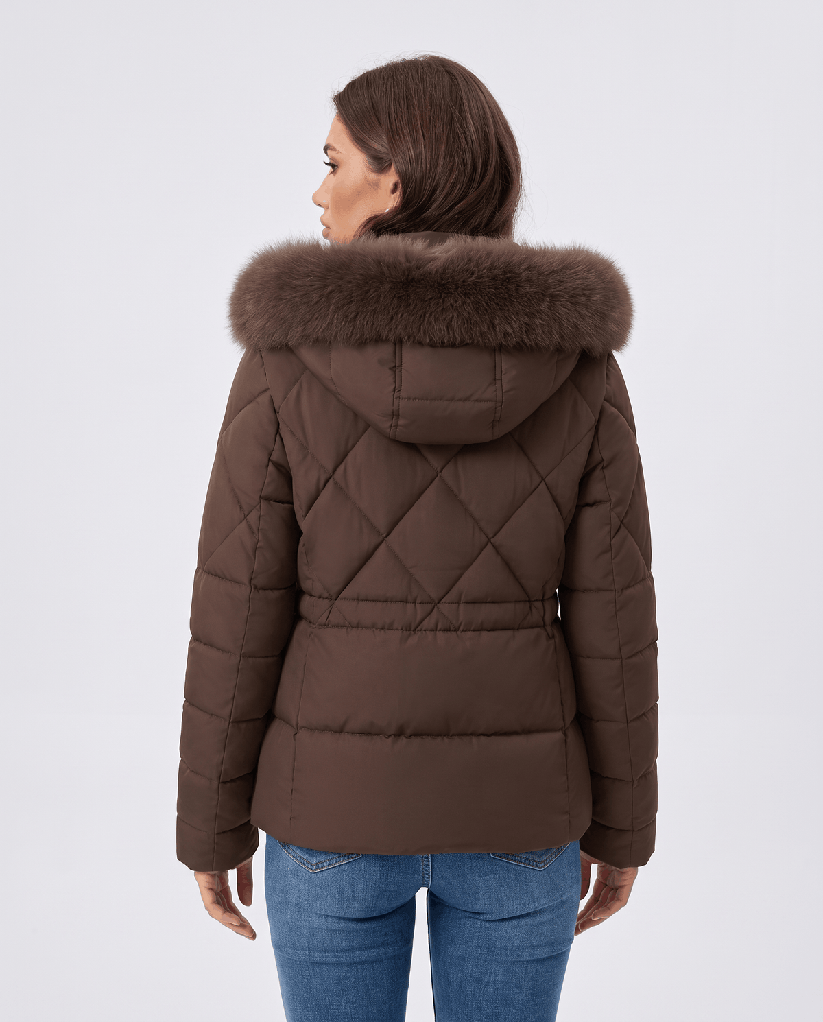 Back view of brown jacket with diamond quilting and plush-trim hood on model