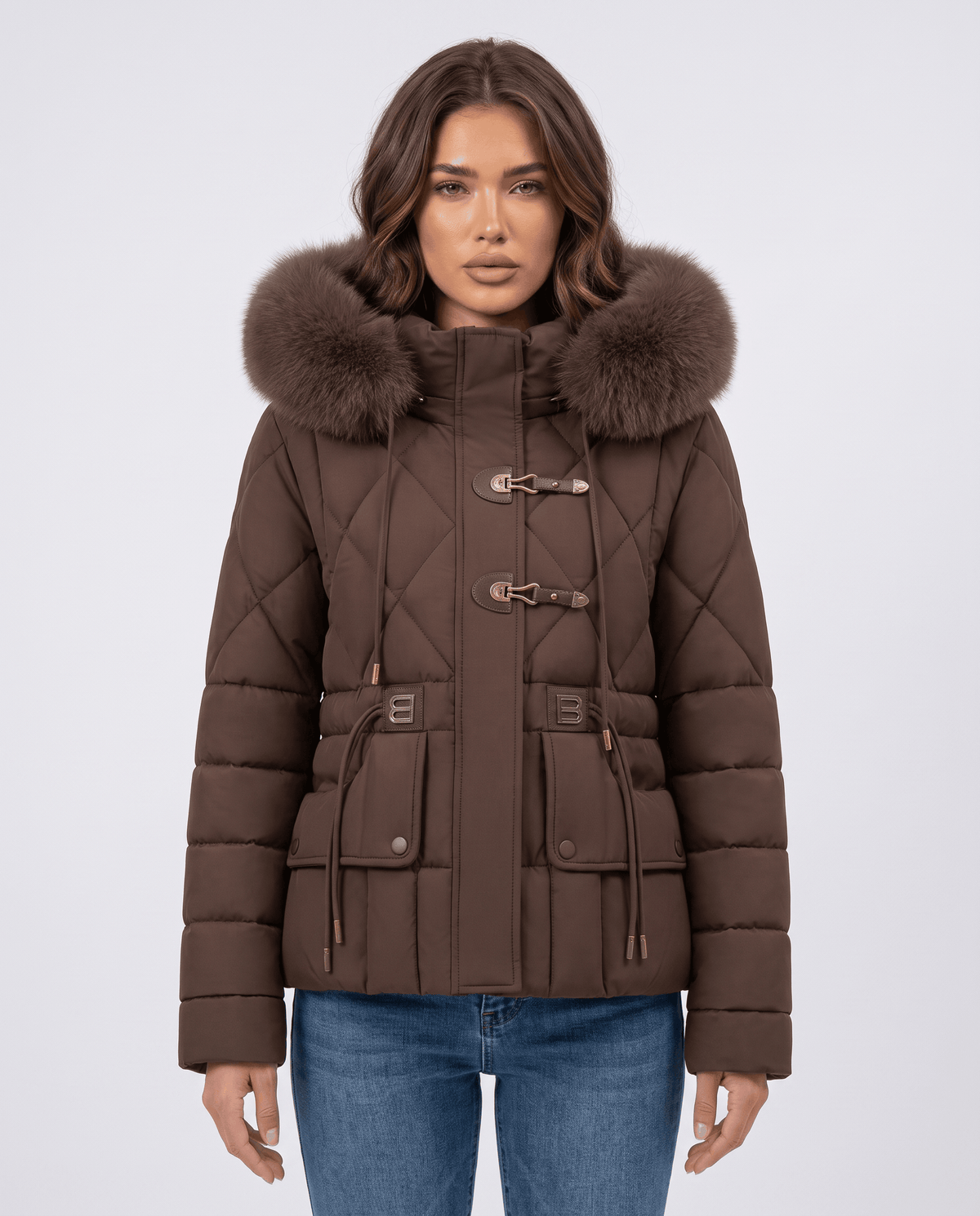 Model in brown quilted jacket with plush-trim hood, front view with arms relaxed