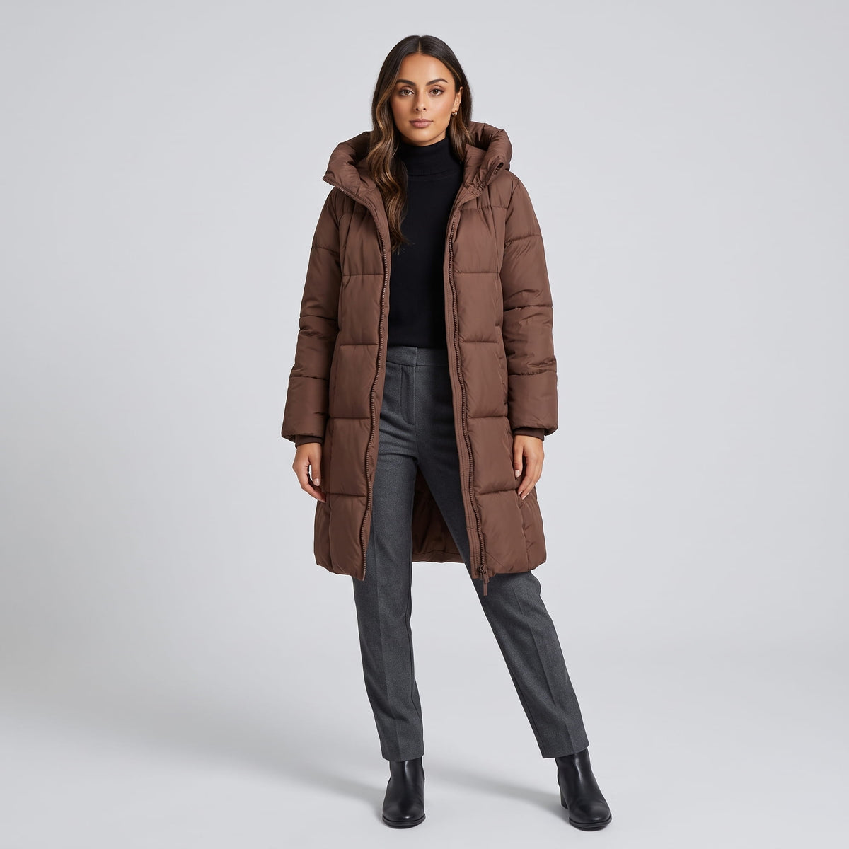 Full-length view of dark brown quilted coat with black ankle boots