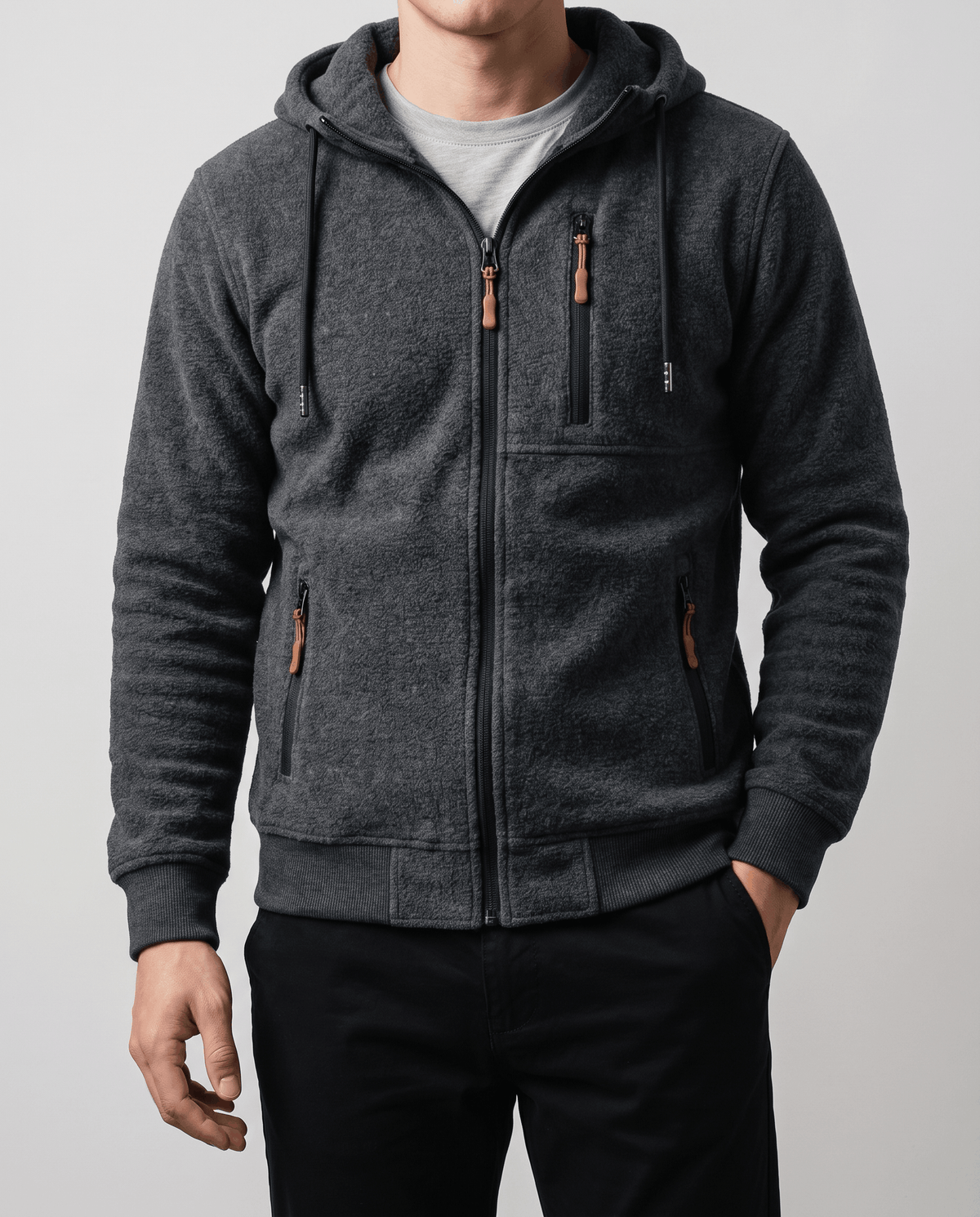 Front view of the dark gray hoodie with chest pocket and contrast zip pulls