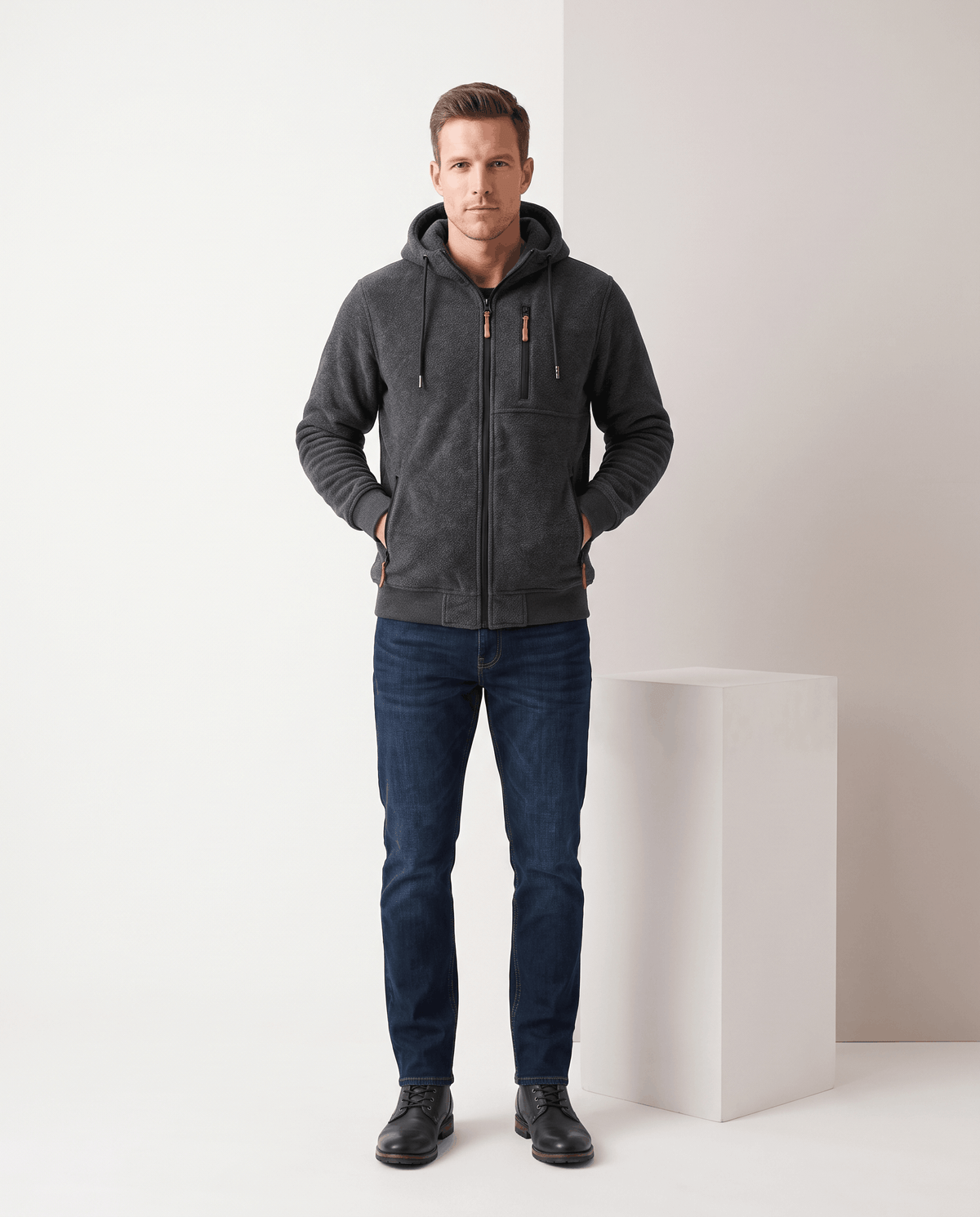 Full-length look with the dark gray hoodie, jeans and dark boots