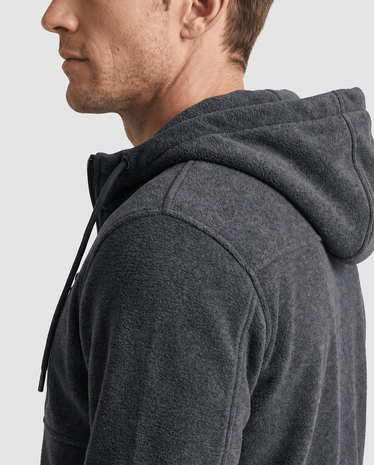 Side view of the dark gray hoodie's hood and drawstring