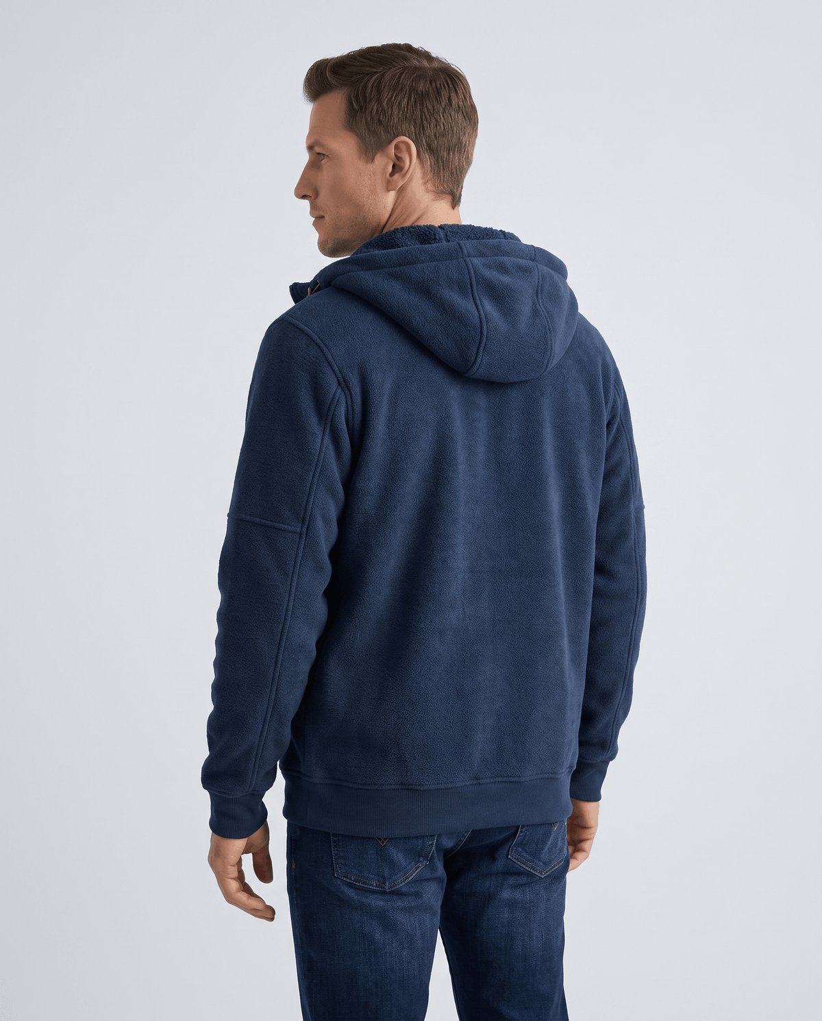 Back view of the navy zip-up hoodie with the hood down