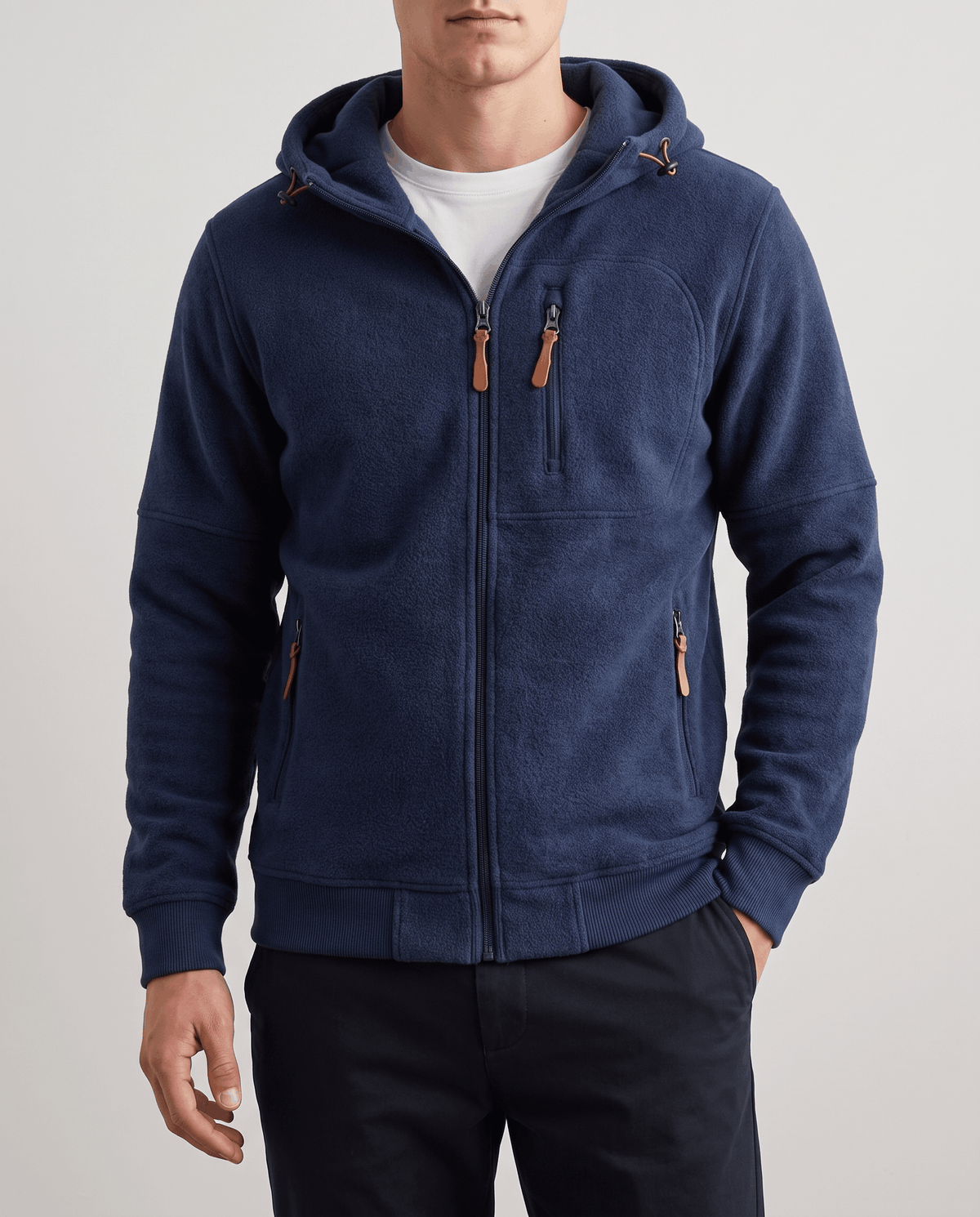 Front view of the navy hoodie showing the zip chest pocket and hand pockets