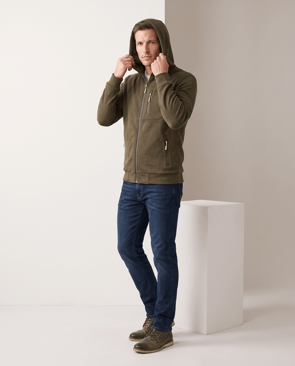 Full-length look with the olive hoodie, blue jeans and brown boots