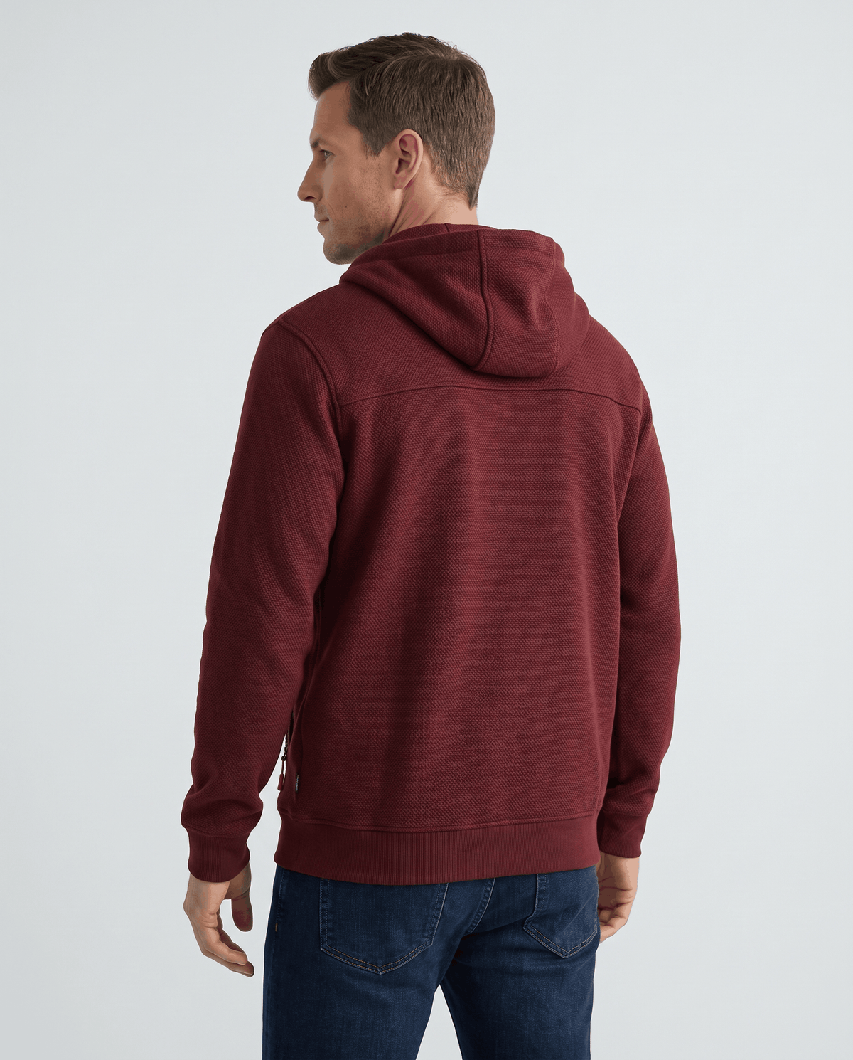 Back view of the red fleece hoodie showing its regular fit