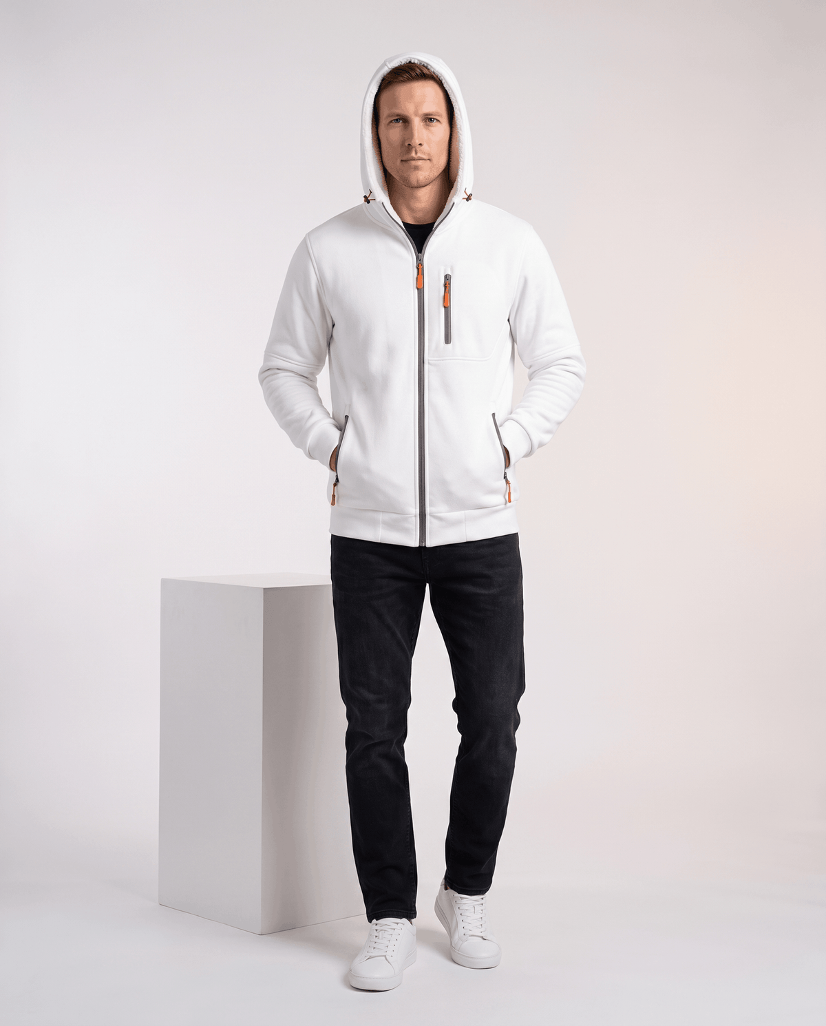 Full-length view of the white hoodie with the hood up and white sneakers