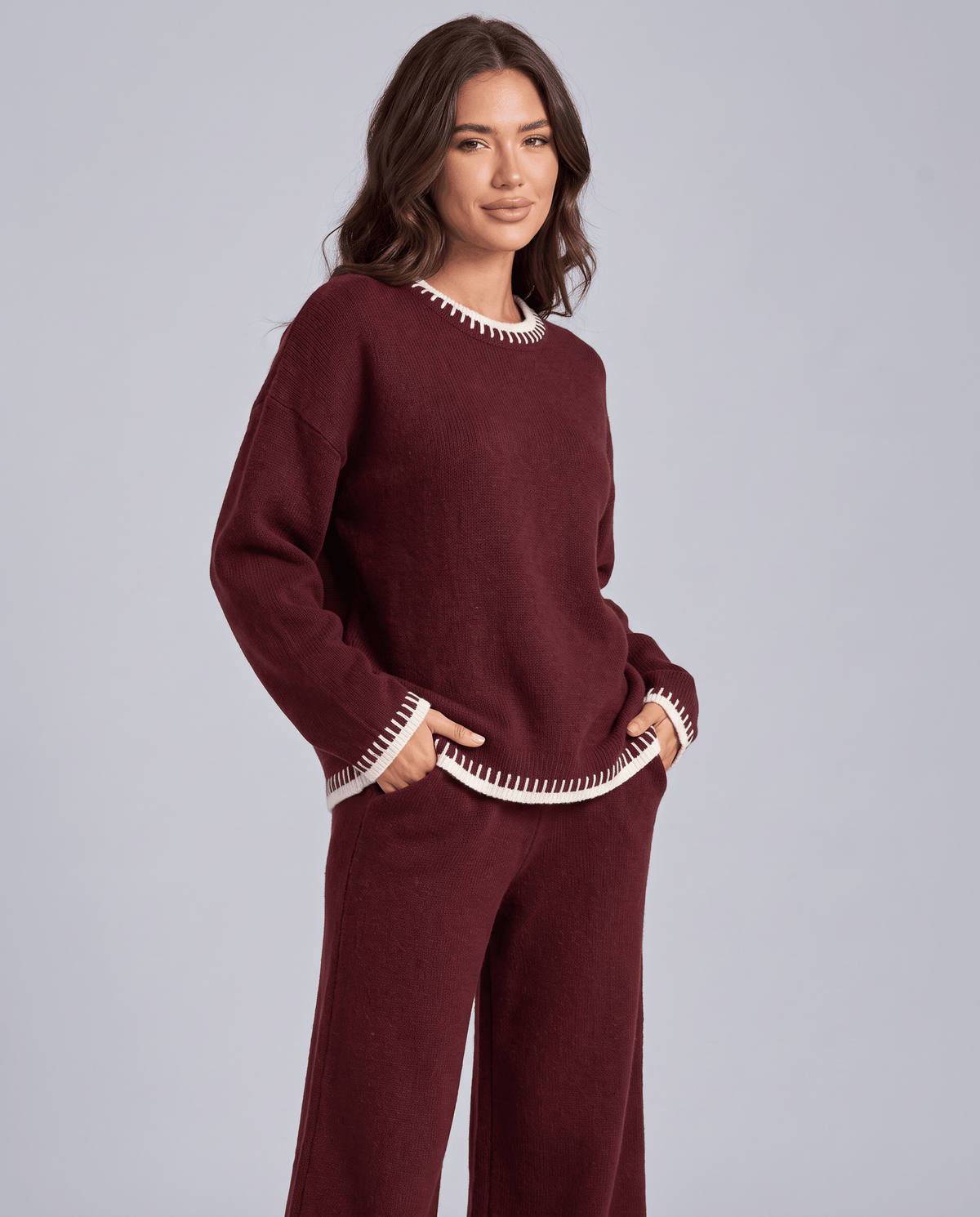 Burgundy knit sweater with relaxed oversized fit, three-quarter front view