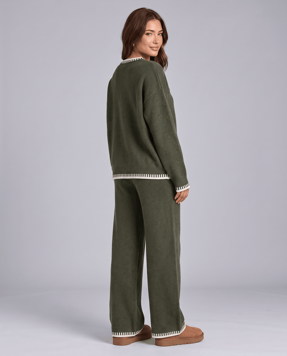 Back view of the dark green knit sweater and wide-leg pants