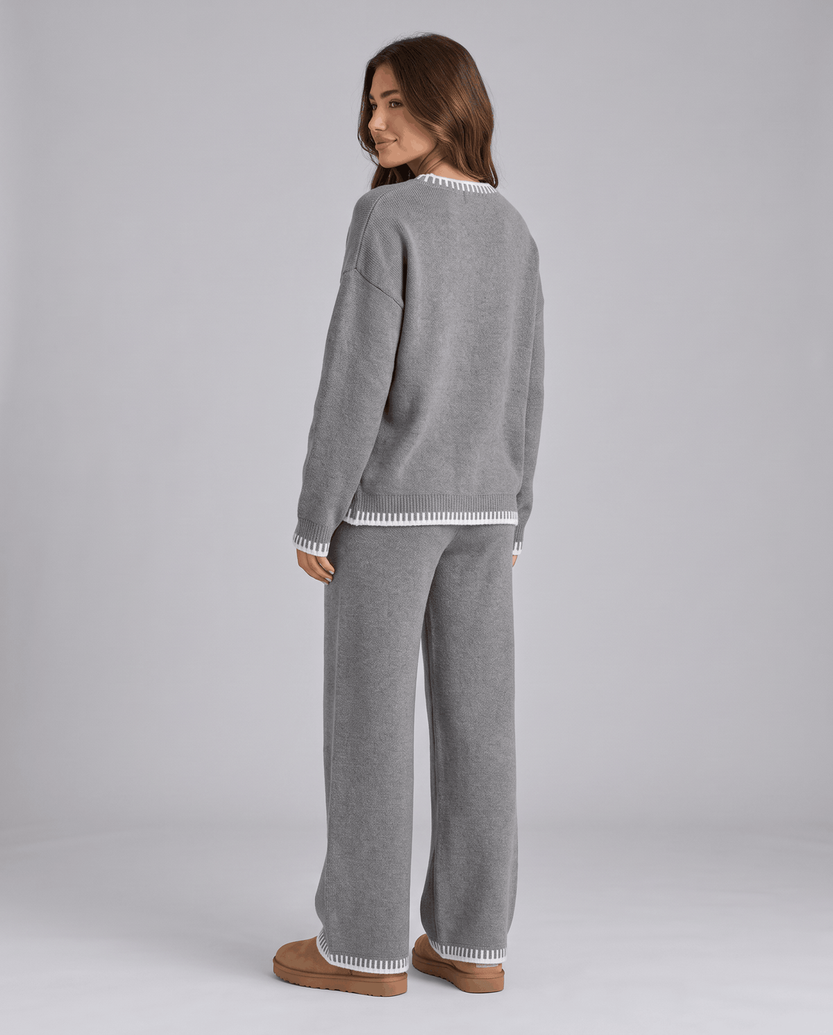 Back view of the grey knit sweater and wide-leg pants