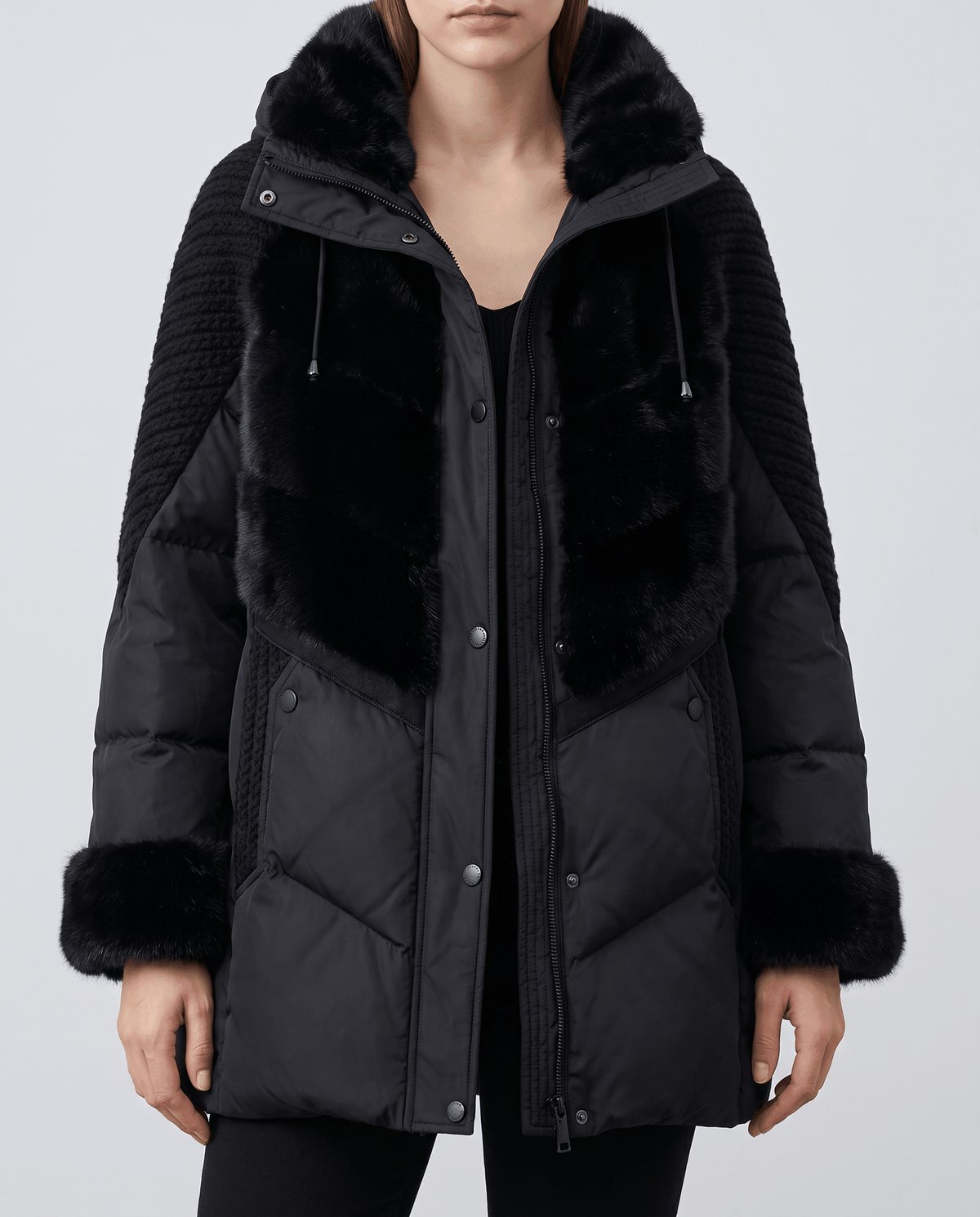 Close-up of black jacket plush yoke, plush cuffs and zip front