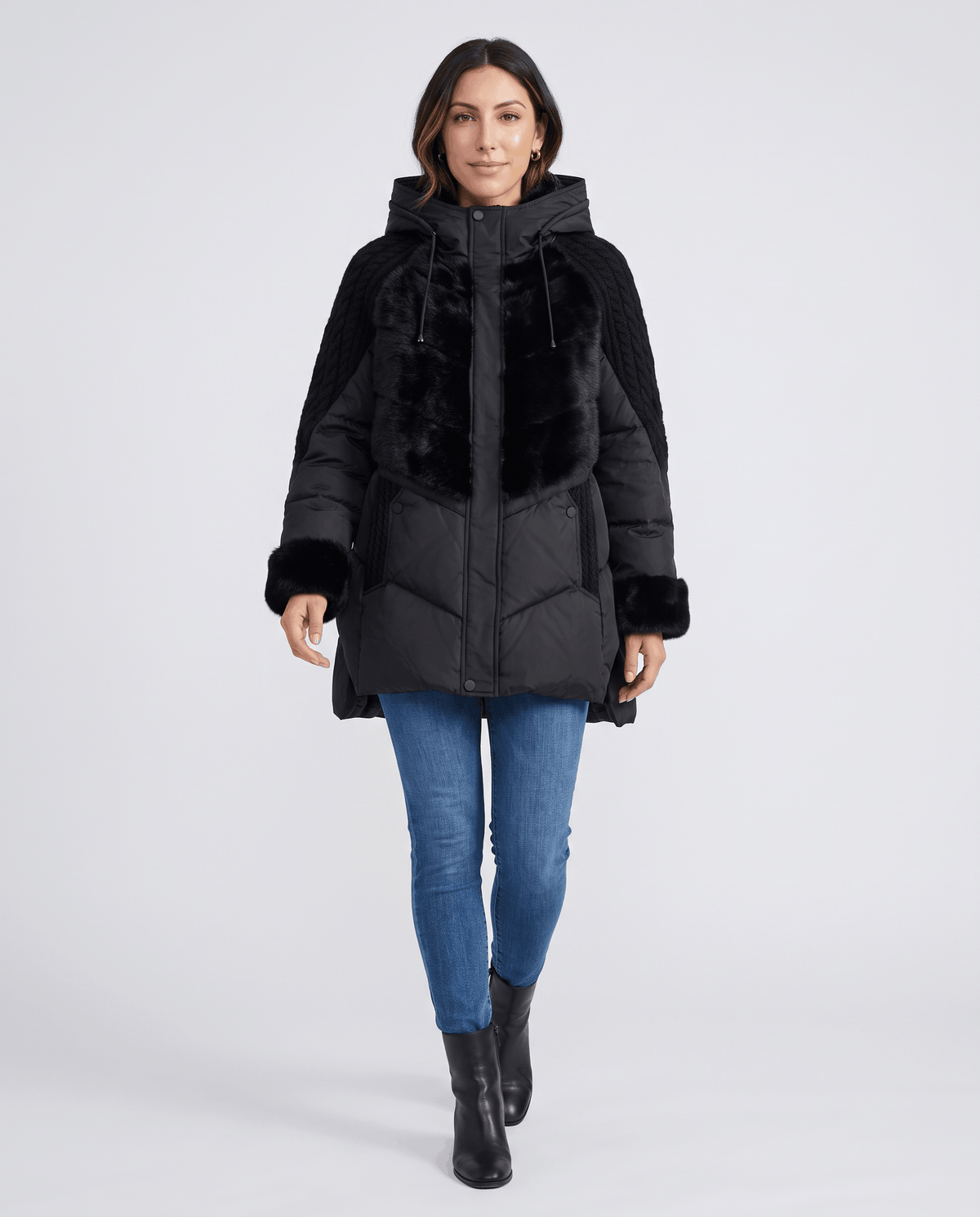 Full-length view of black jacket with blue jeans and black boots