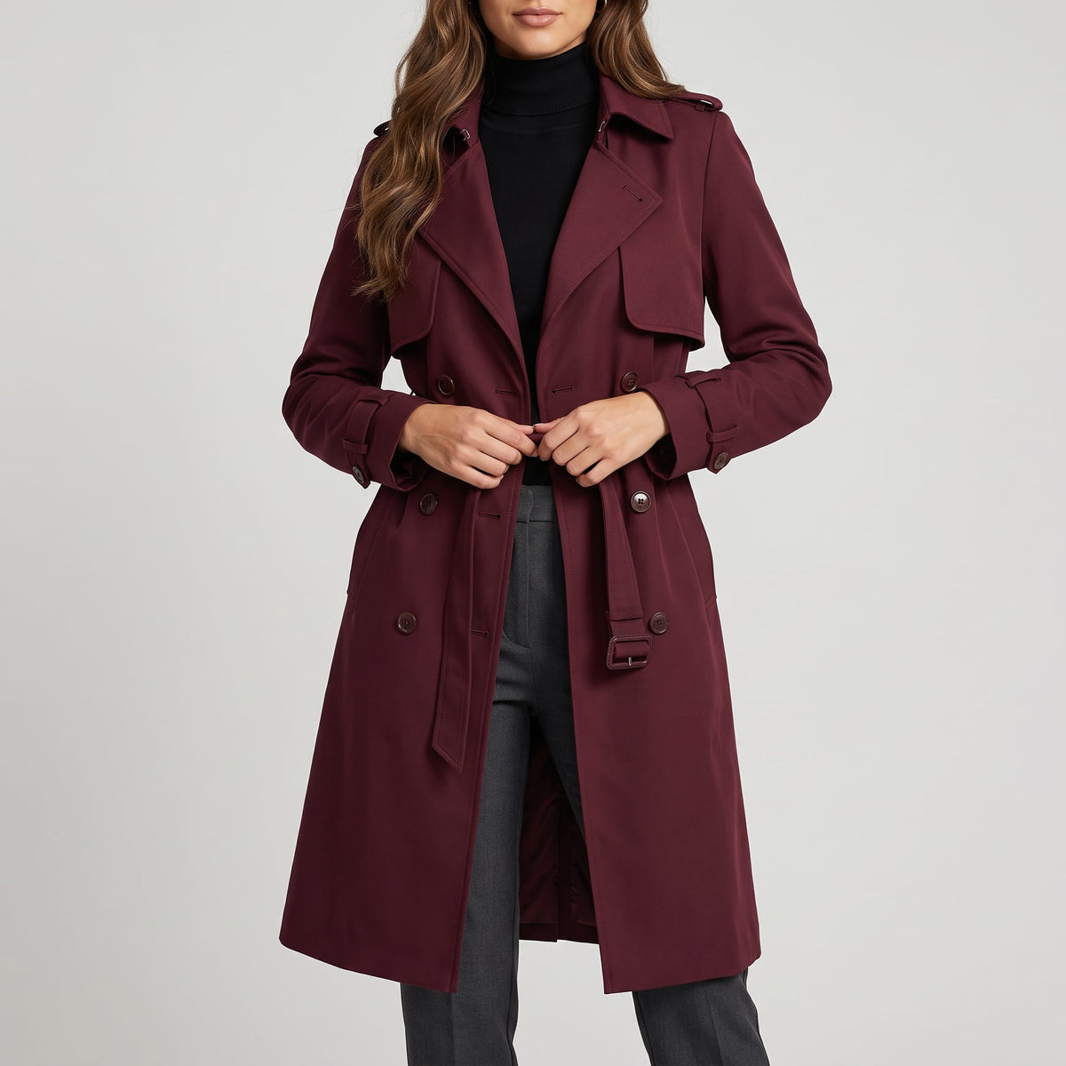 Burgundy coat worn open with the belt loose over gray trousers