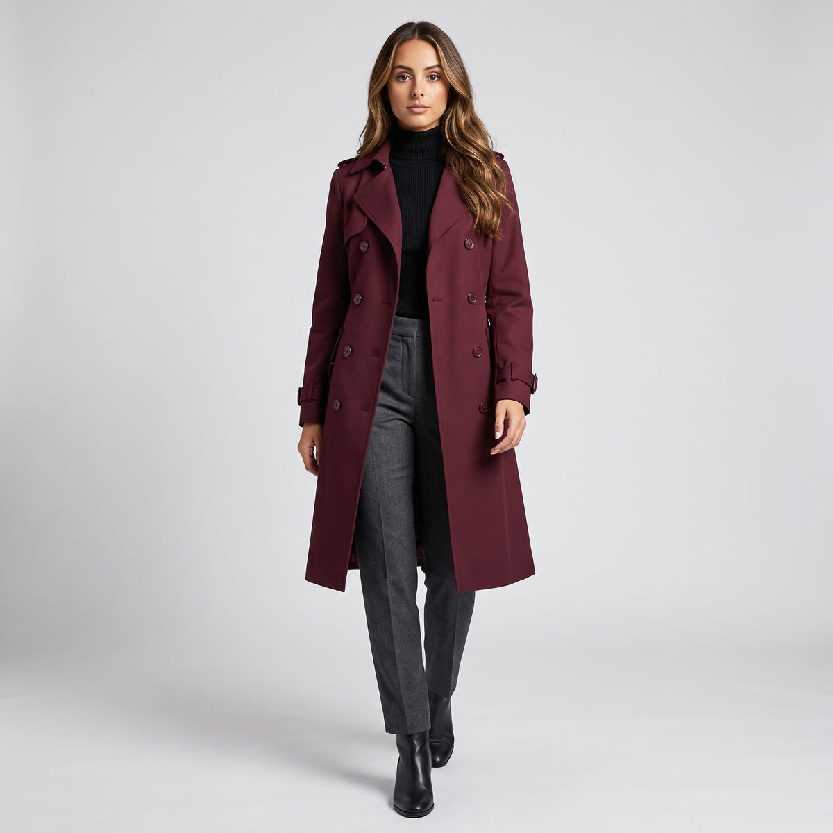 Model walking in the burgundy coat styled with a black turtleneck