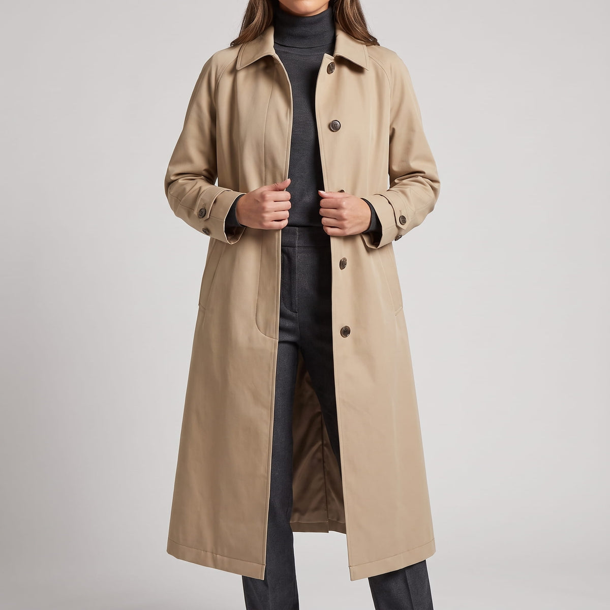 Khaki coat held open to show the single-breasted placket and inner lining