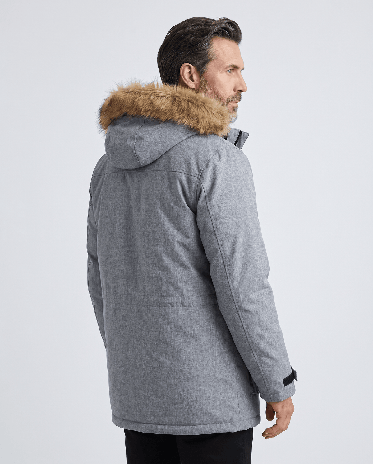 Back view of gray parka showing the hood with fur trim and straight body