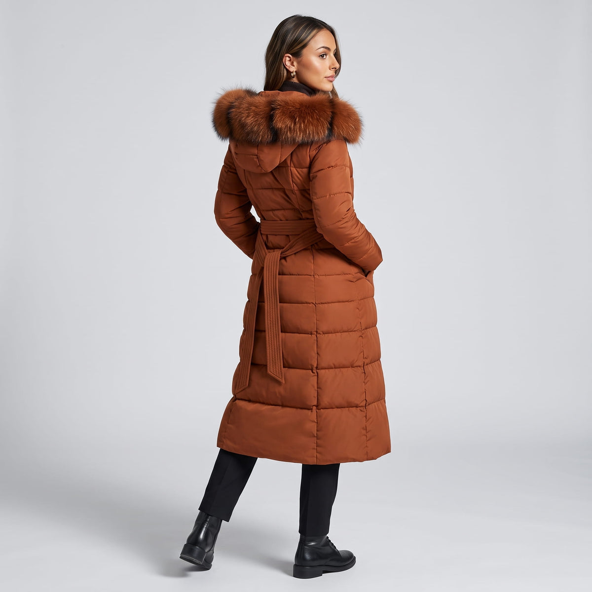 Back view of caramel coat with hood and quilted channels