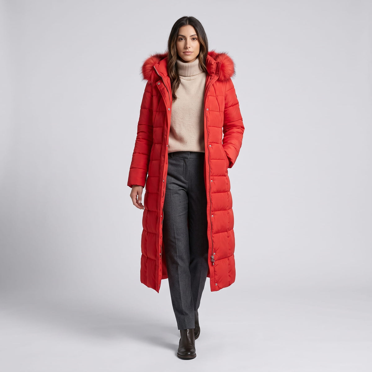 Model walking in red long puffer coat with plush trim hood