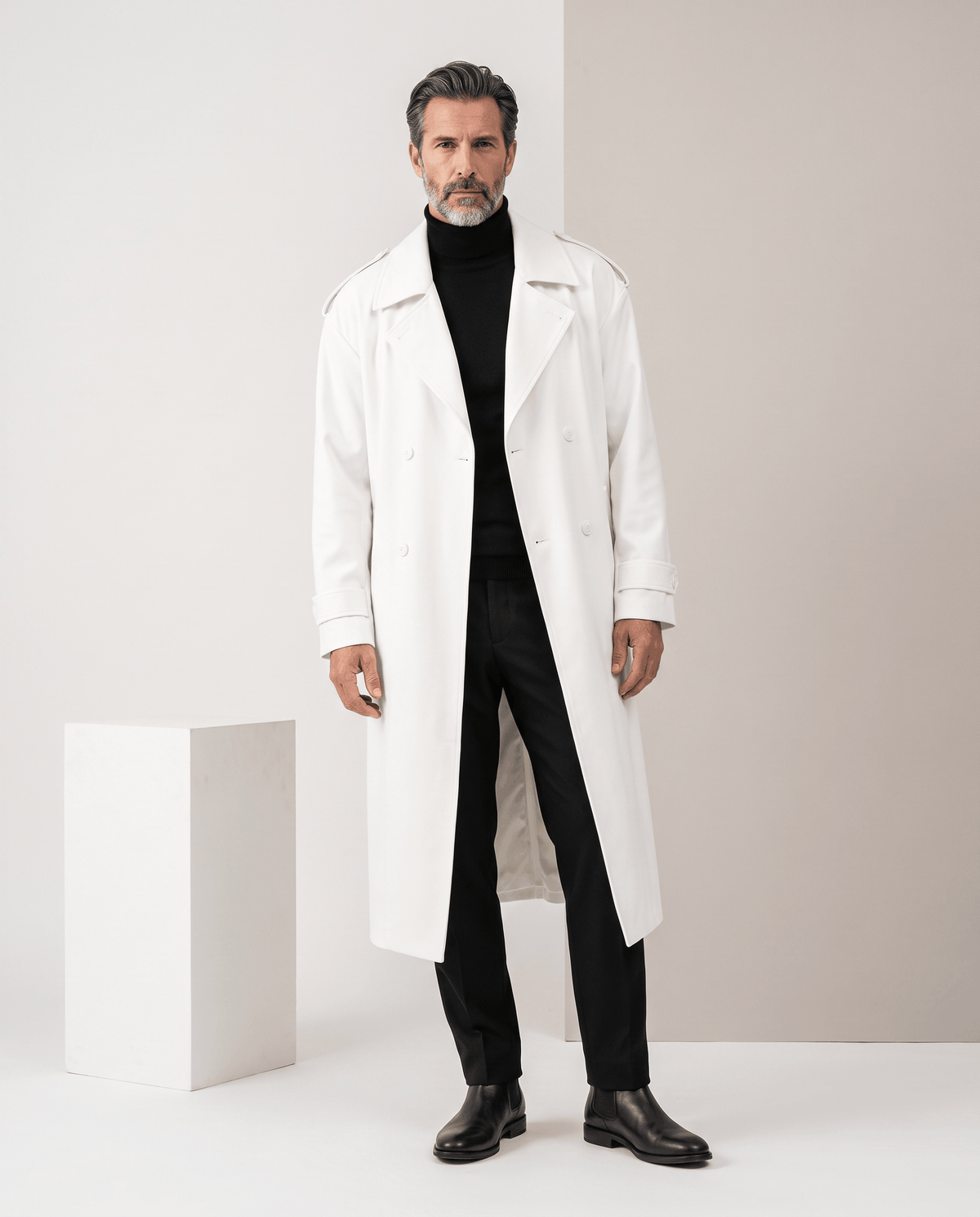 Full-length white trench coat worn open with black turtleneck and trousers