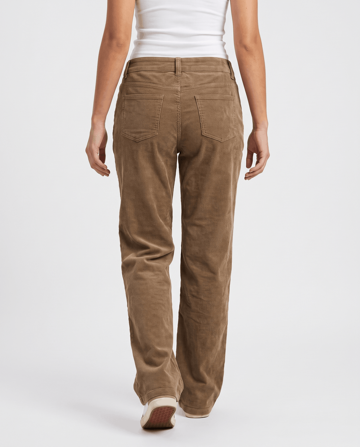Back view of taupe corduroy pants walking away, showing the relaxed fit and flared hem