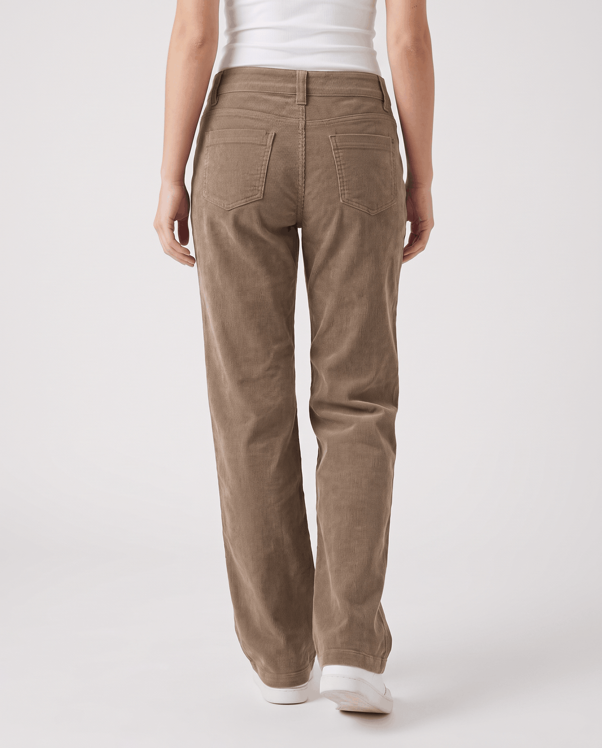 Rear view of khaki low-rise trousers with back patch pockets and white sneakers