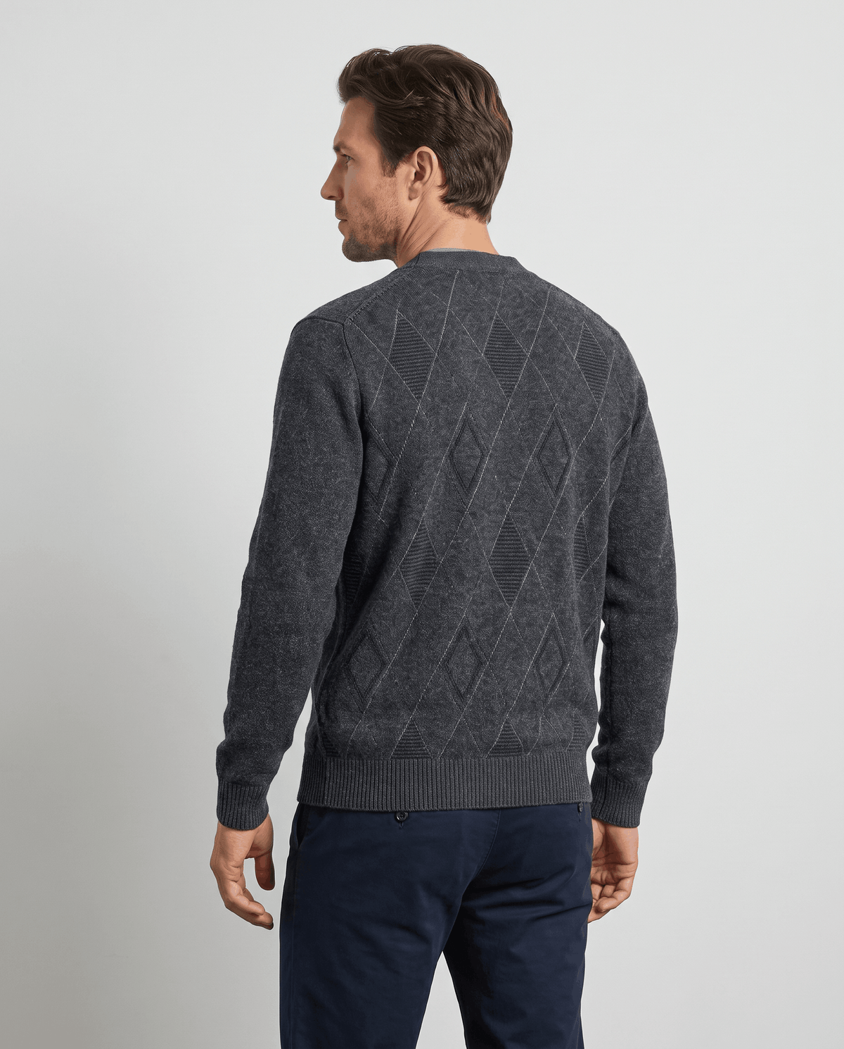 Back view of the dark gray cardigan with tonal diamonds and ribbed hem