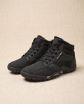 Black men's barefoot boots with wide toe box and thin flexible sole, angled view