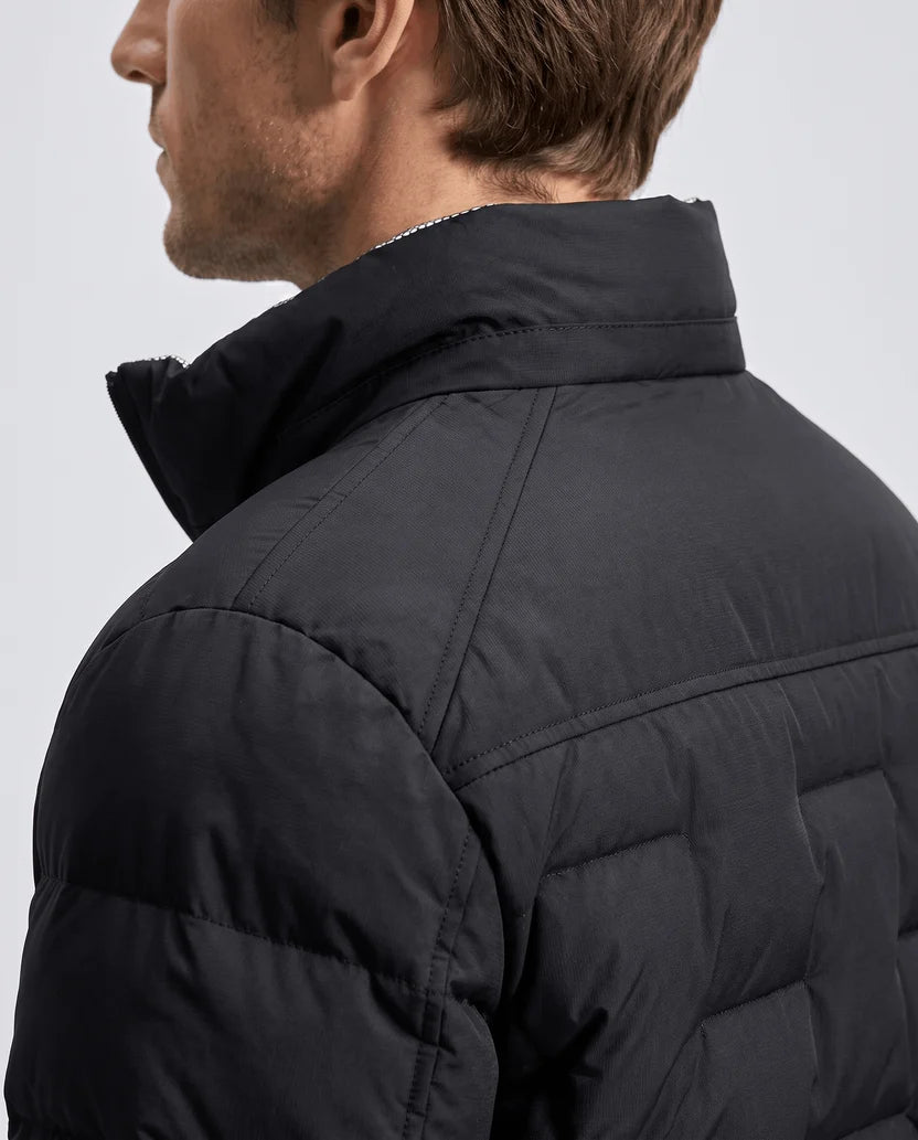 Close-up of the stand collar and quilting on a black puffer jacket