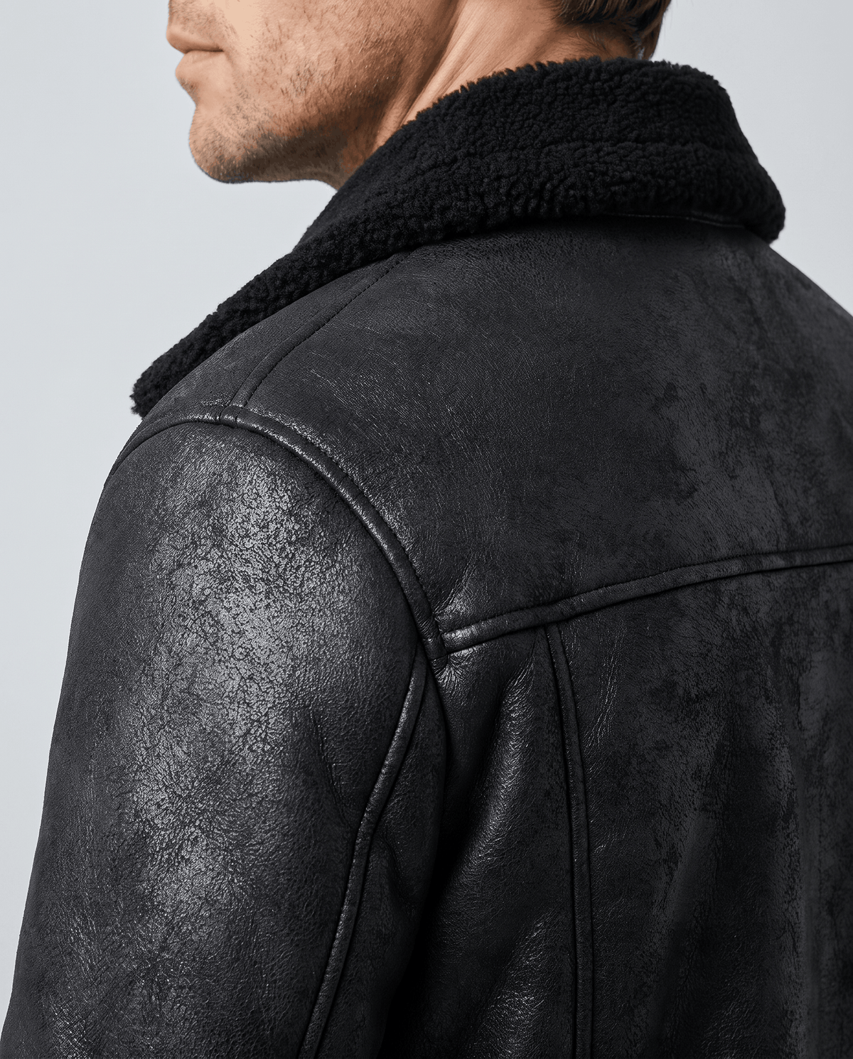 Shoulder and collar detail of the Harlan black vegan suede aviator jacket