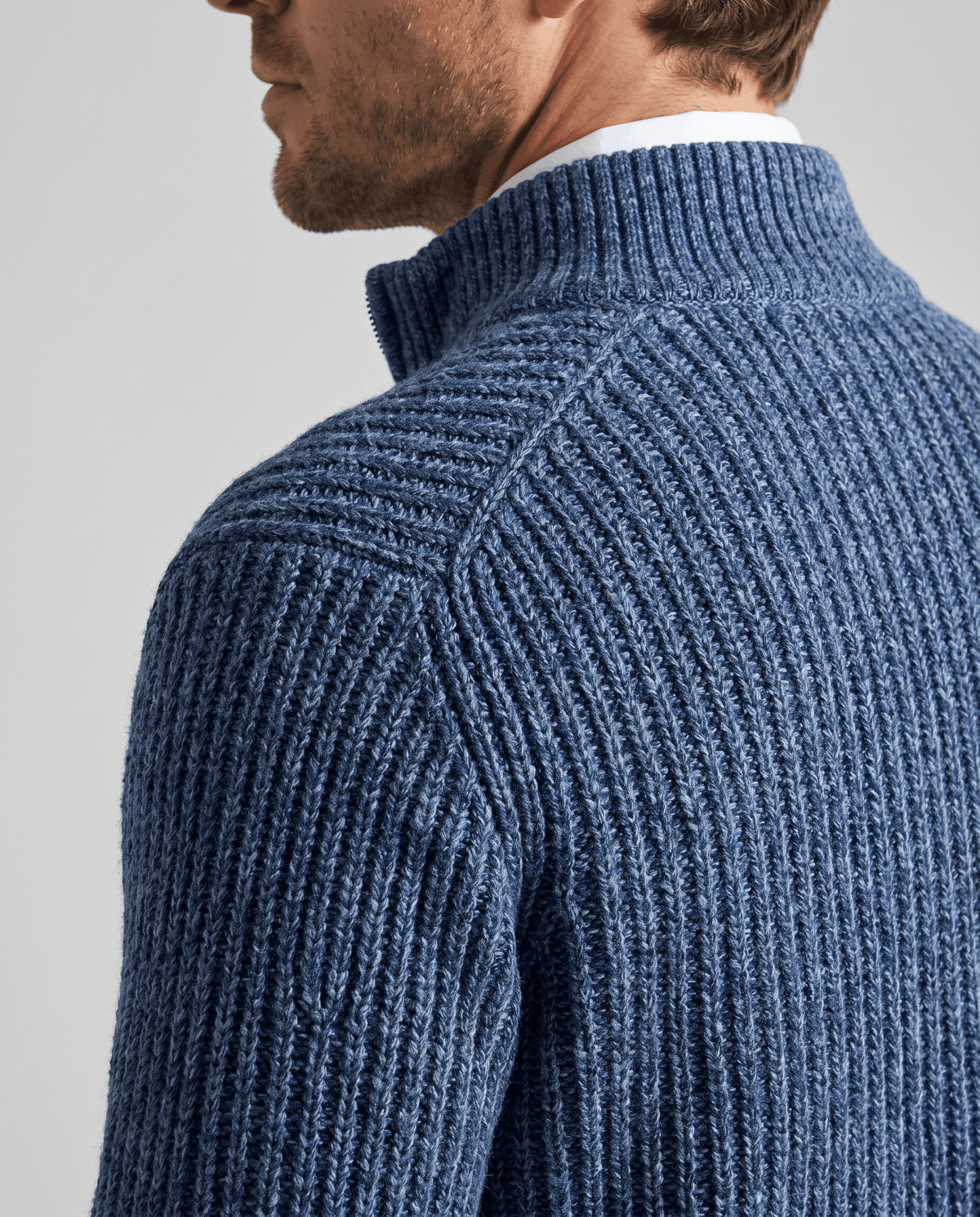 Shoulder and ribbed knit texture of the Julian blue wool cardigan
