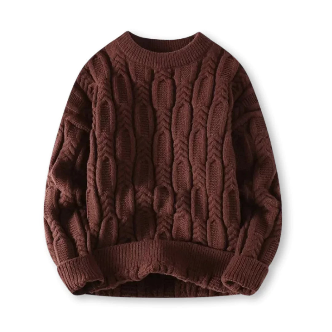 Flat-lay of brown crew neck cable sweater on a white background
