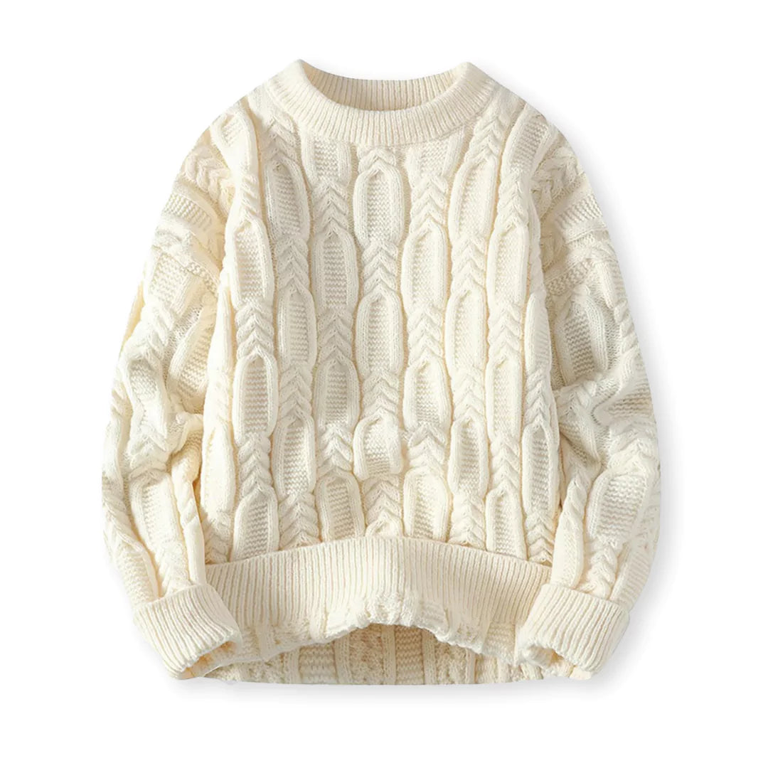 Flat-lay of cream braided cable sweater on a white background