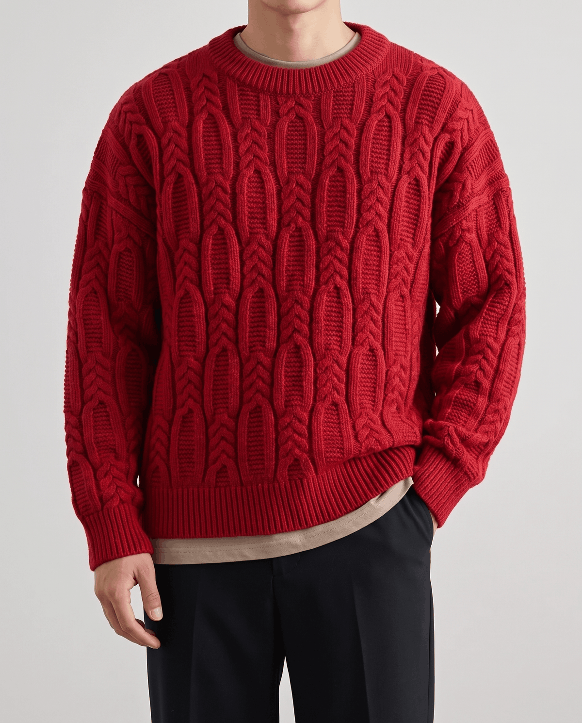 Front close-up of red braided cable knit with ribbed crew collar