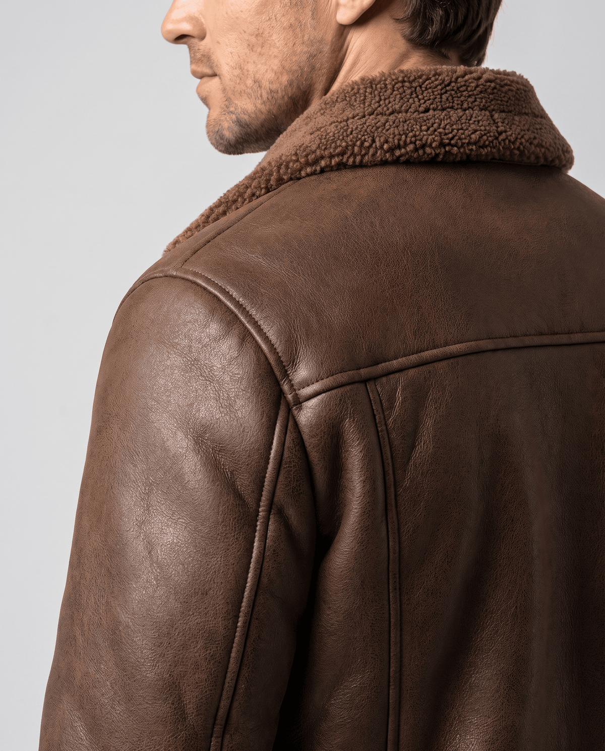 Shoulder and collar detail of the Harlan brown vegan suede aviator jacket