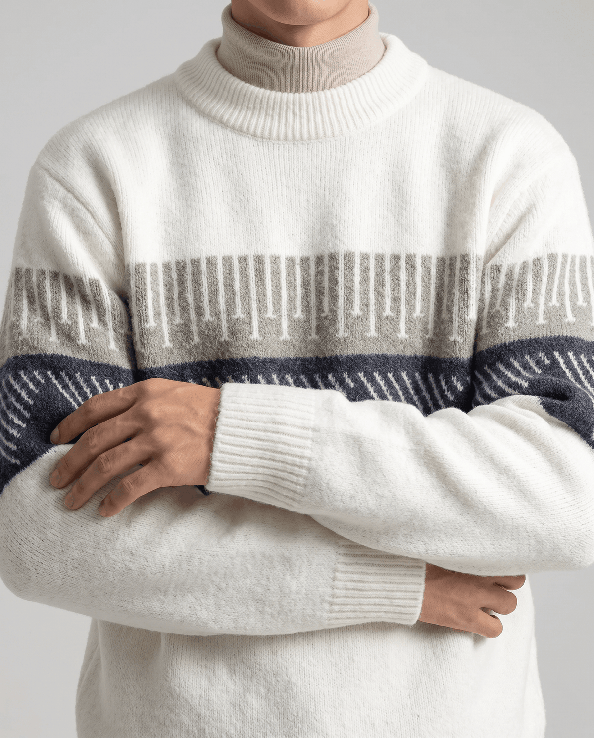 White brushed knit sweater over a cream mock neck with arms crossed