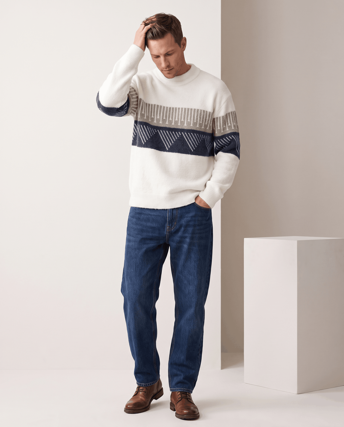 Full-length white brushed sweater outfit with dark jeans and brown boots