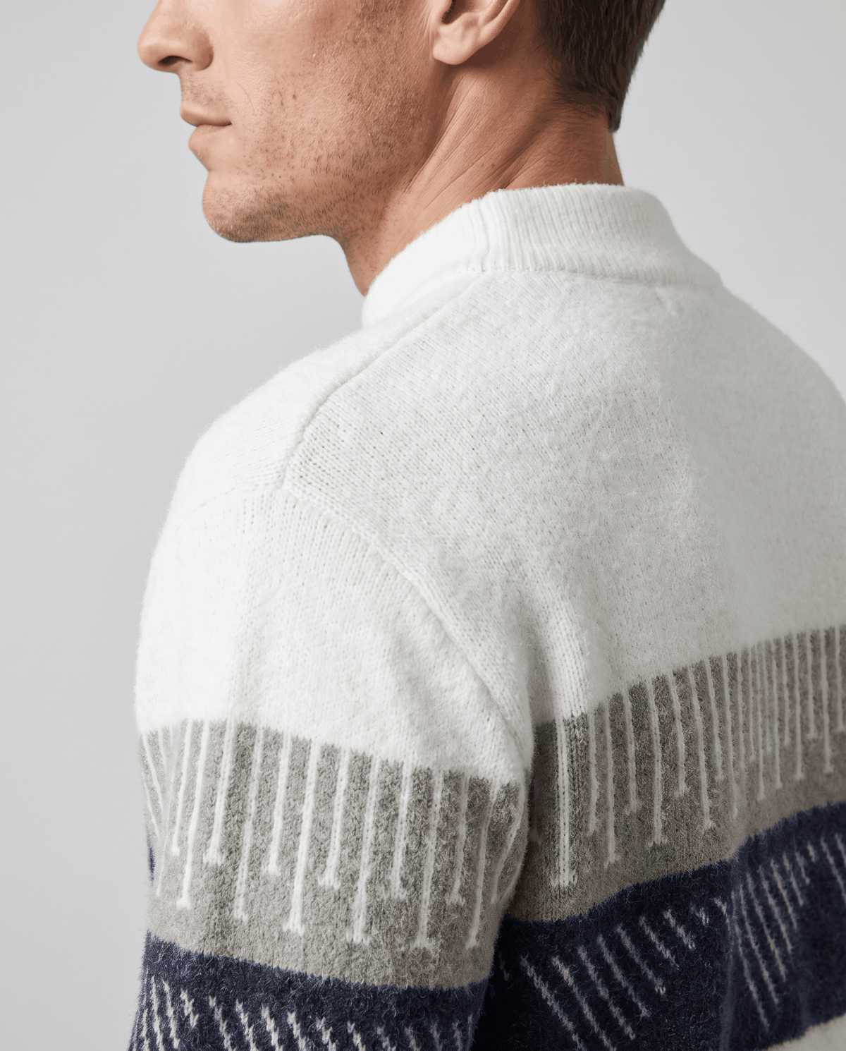 Side close-up of dropped shoulder seam and patterned sleeve band
