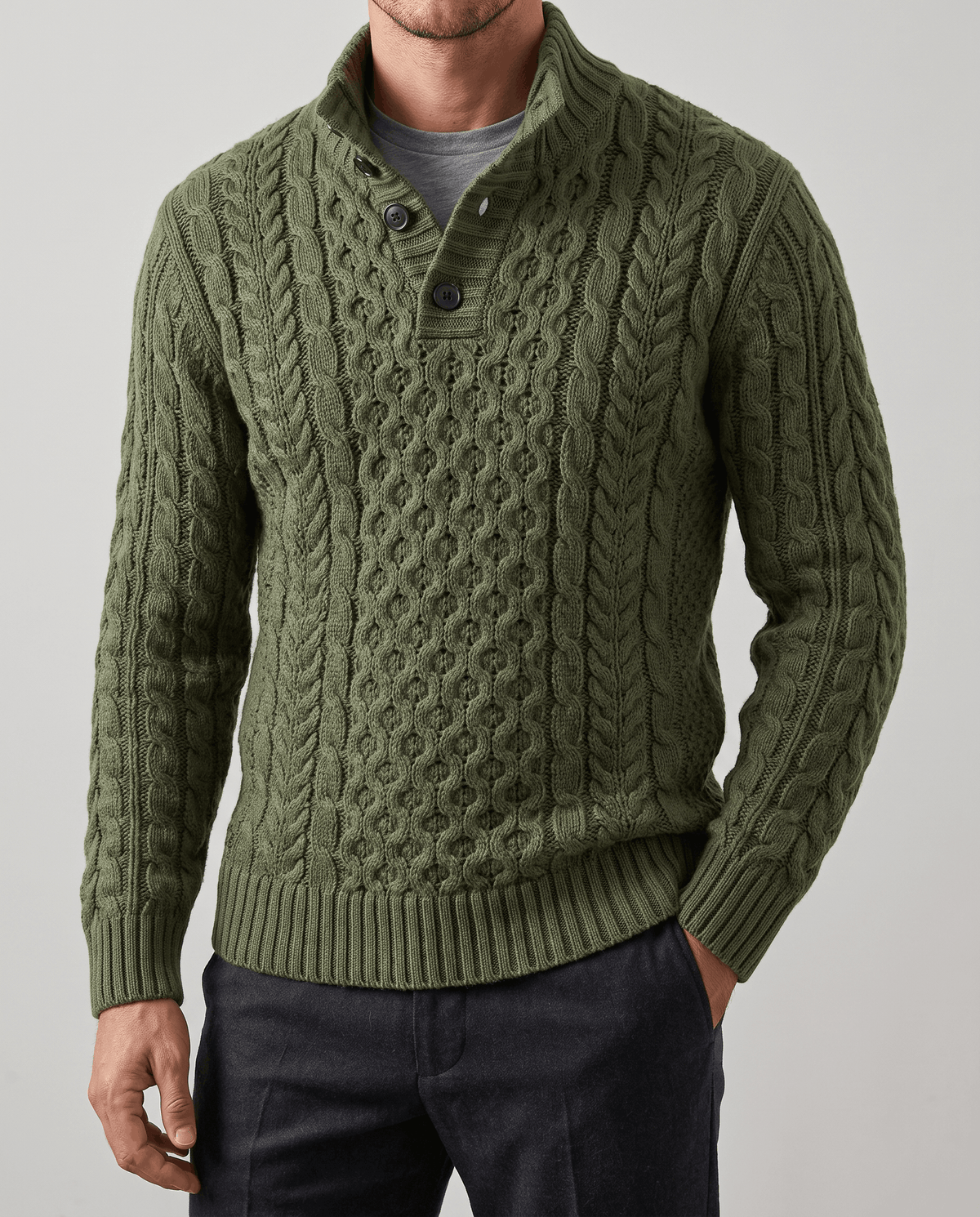 Front close-up of dark green cable knit with open placket over a gray tee