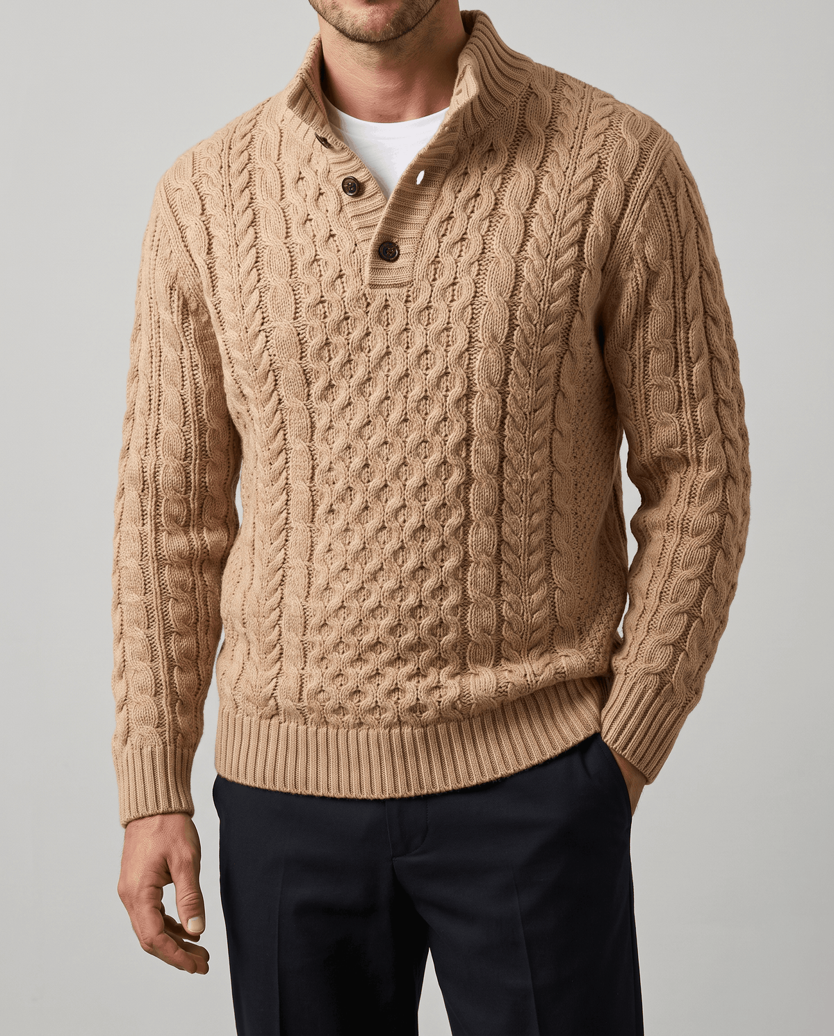 Front close-up of khaki cable knit with open button placket over a white tee