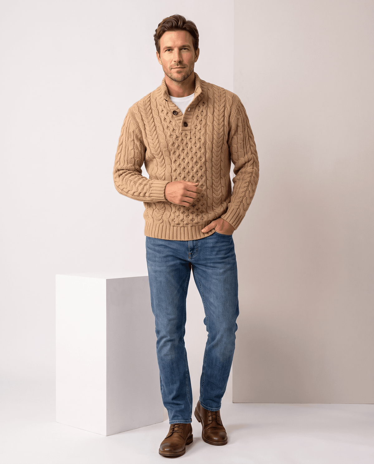 Full-length khaki button neck sweater outfit with jeans and brown boots