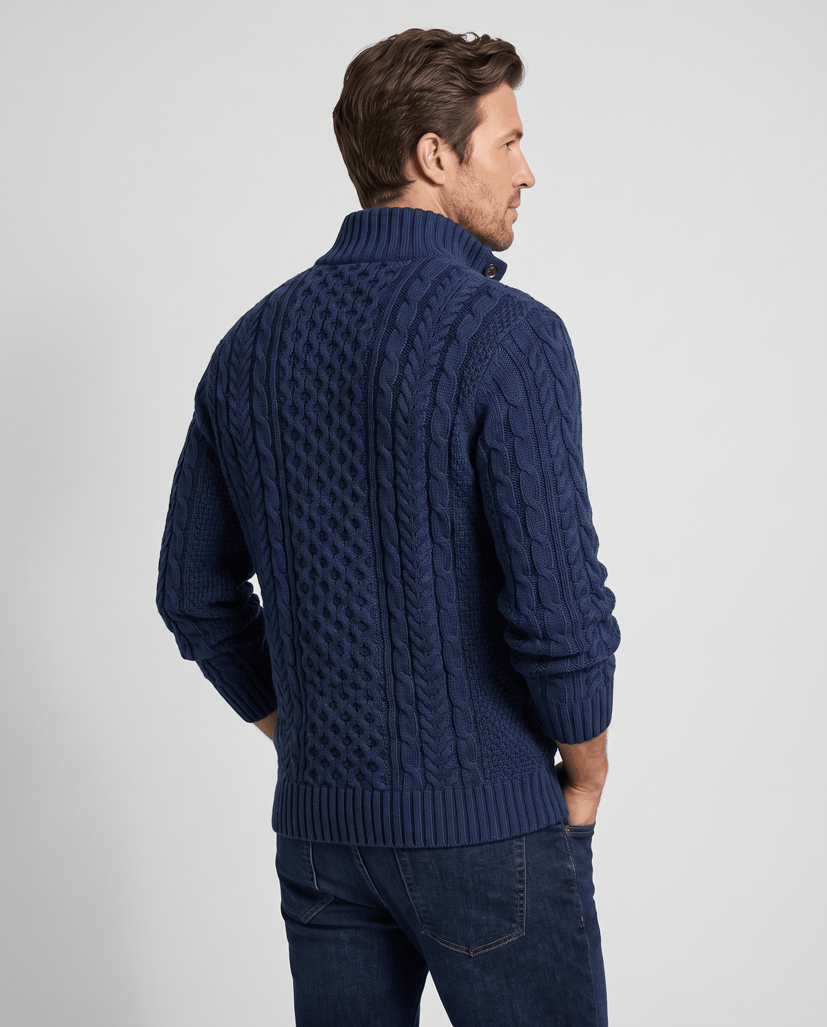 Back view of navy cable pullover with ribbed stand collar