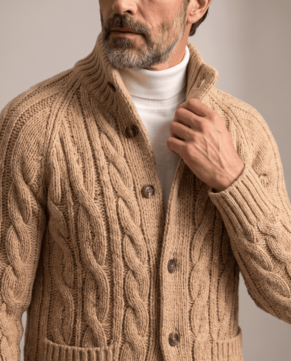 Light brown cardigan stand collar and button placket shown up close