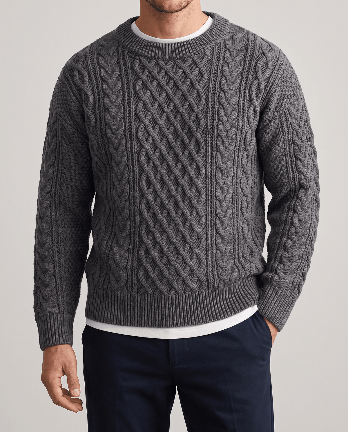 Charcoal gray cable knit front with white tee visible at the neckline