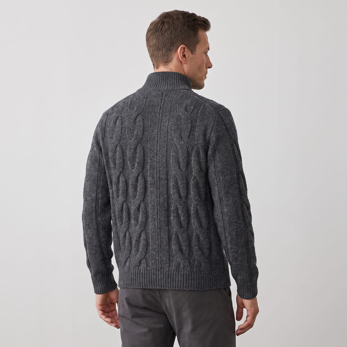 Back view of the gray cable knit cardigan with ribbed hem