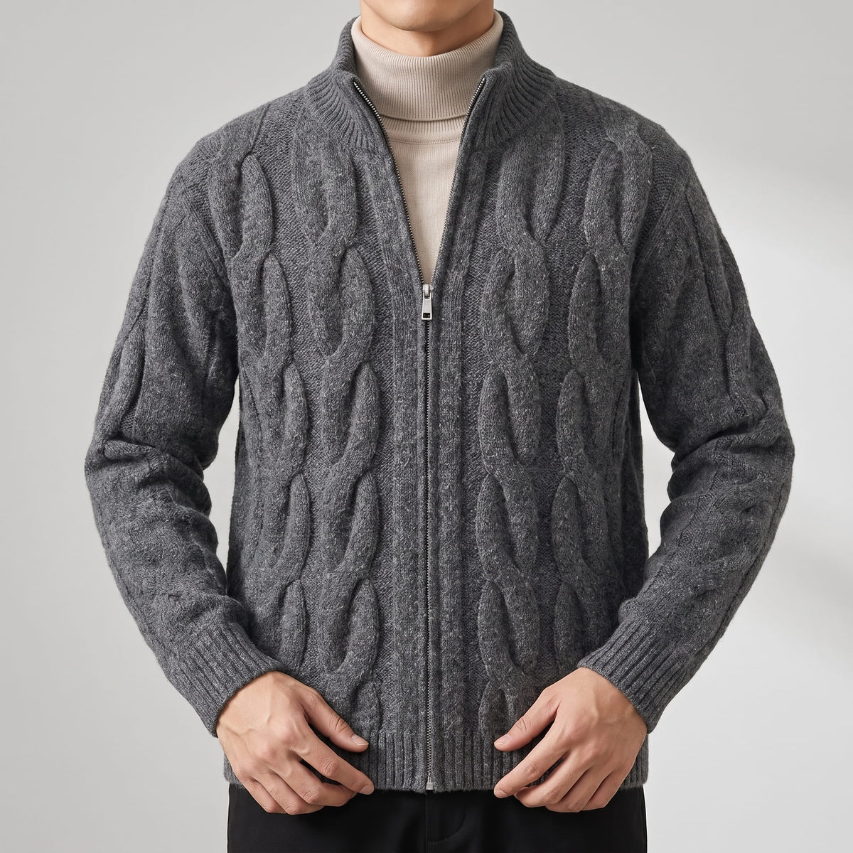 Gray zip cardigan open over a cream turtleneck showing cable panels