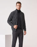 Gray cable knit zip cardigan worn open over a black turtleneck