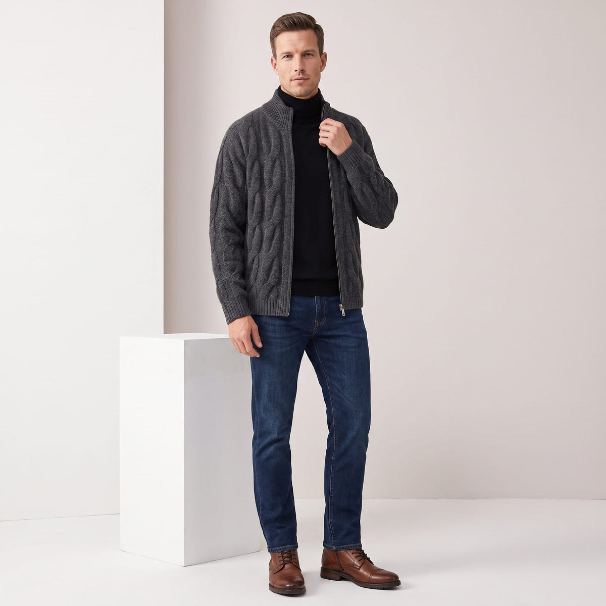 Full-length view of the gray cardigan with blue jeans and brown shoes