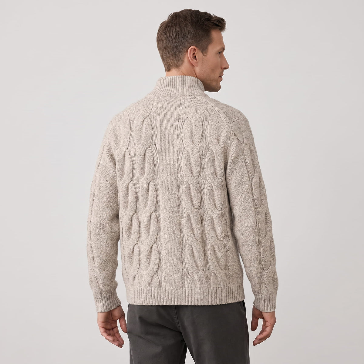 Back view of the khaki cable knit cardigan with charcoal trousers