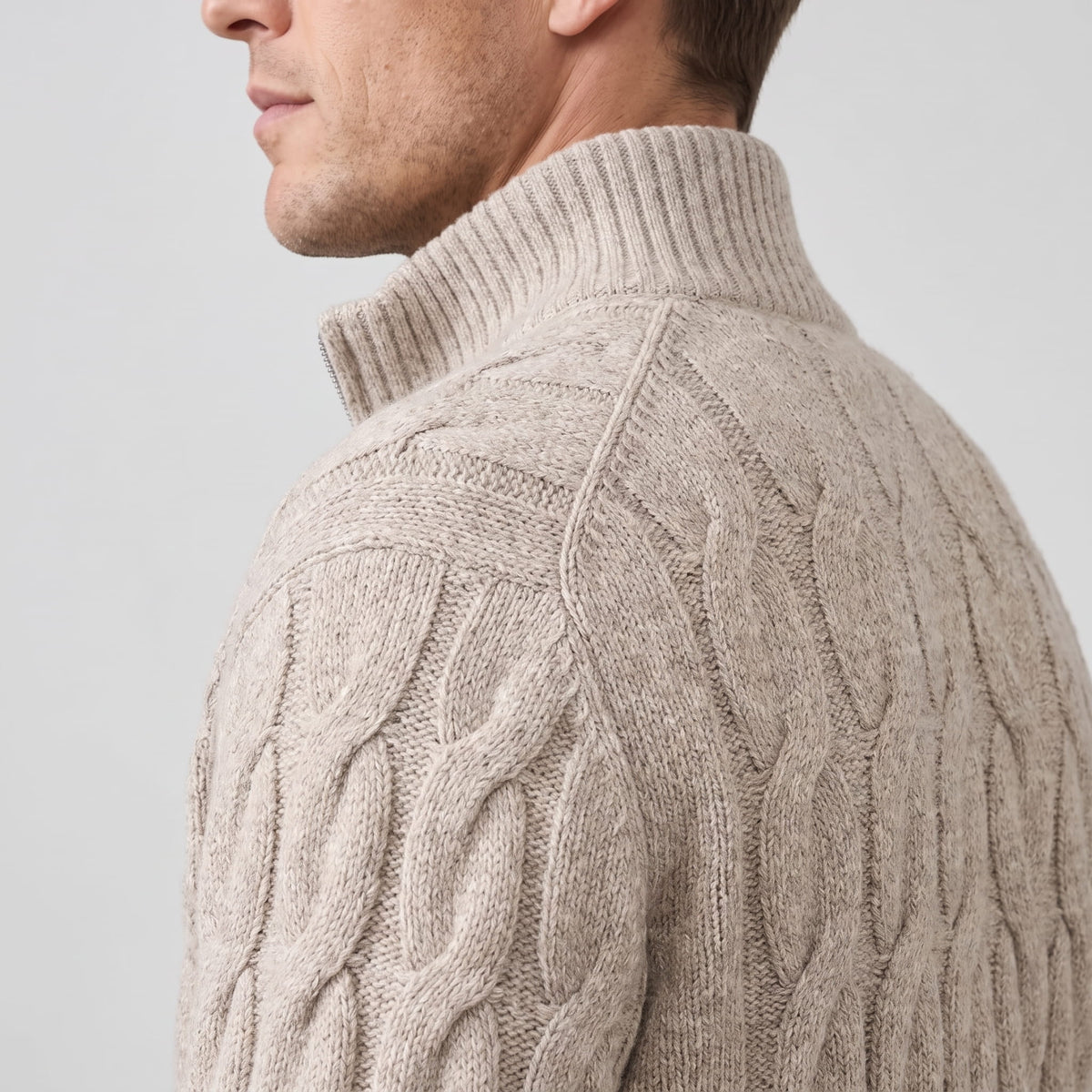 Side profile of the khaki cardigan showing the tall ribbed stand collar