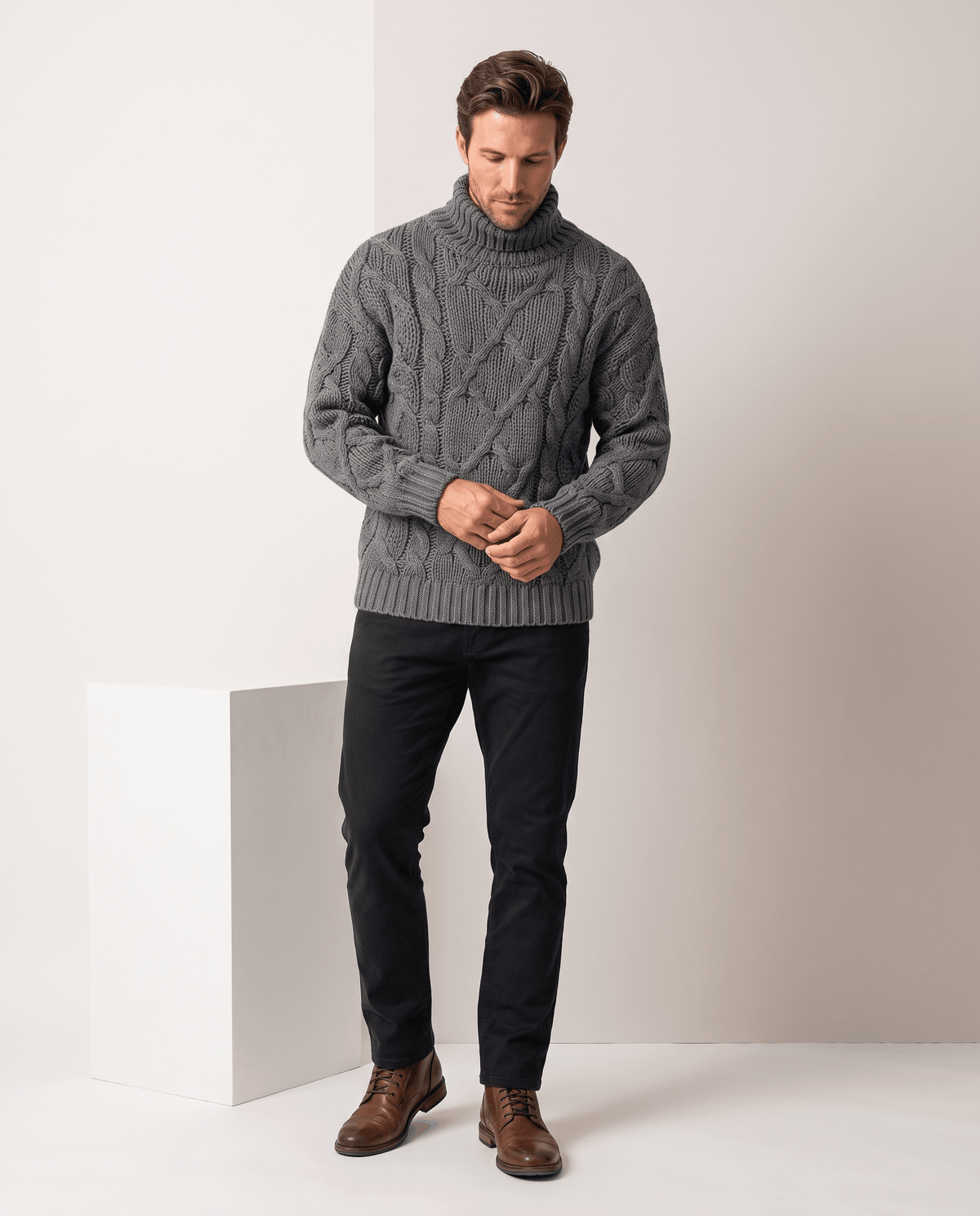 Full-length heather gray turtleneck outfit with black trousers and brown leather boots